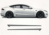White Tesla Model S with black wheels on a white background, featuring AHA Graphics logo.